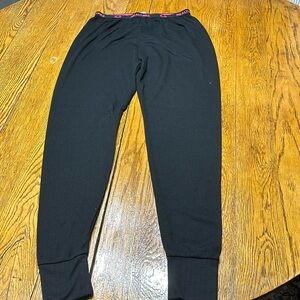 Realtree brand black long underwear.  Pink logo on elastic waist.  Size XL girls
